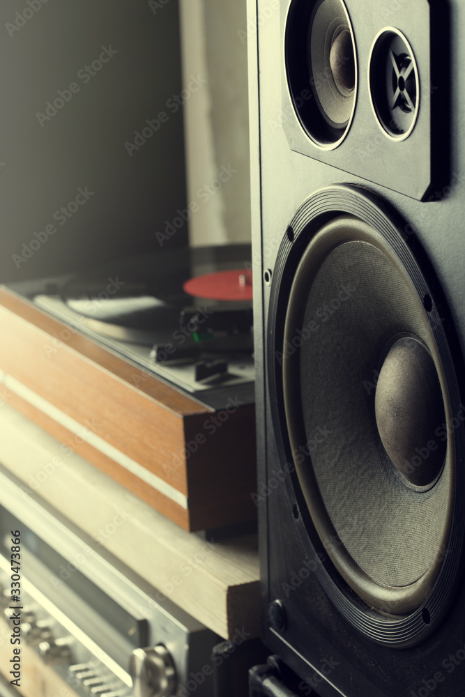 HiFi system with turntable, amplifier, headphones and lp vinyl records in a listening room