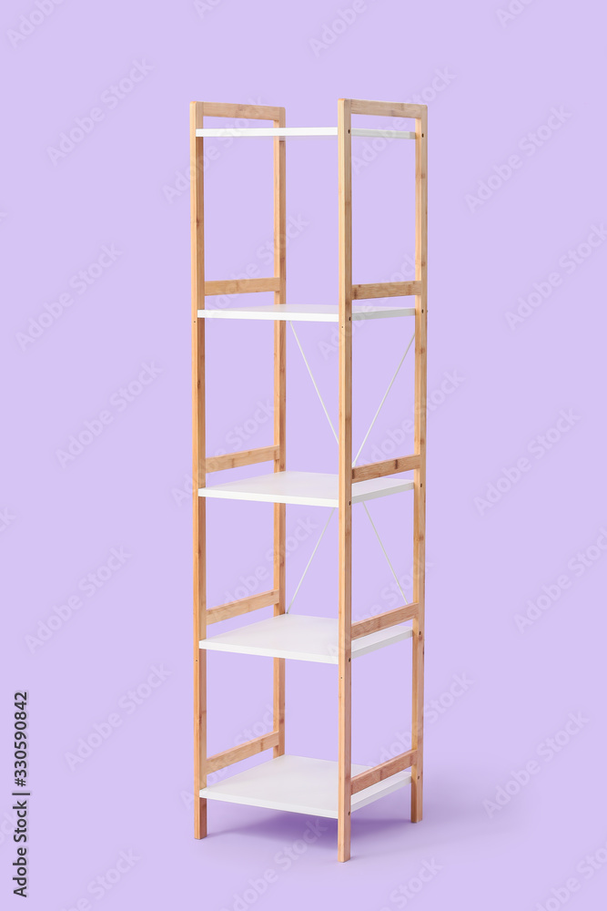 Empty shelving unit on color background