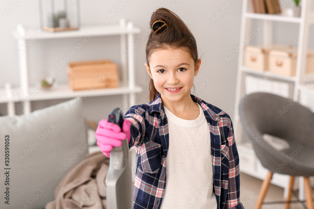 Little housewife with bottle of detergent at home