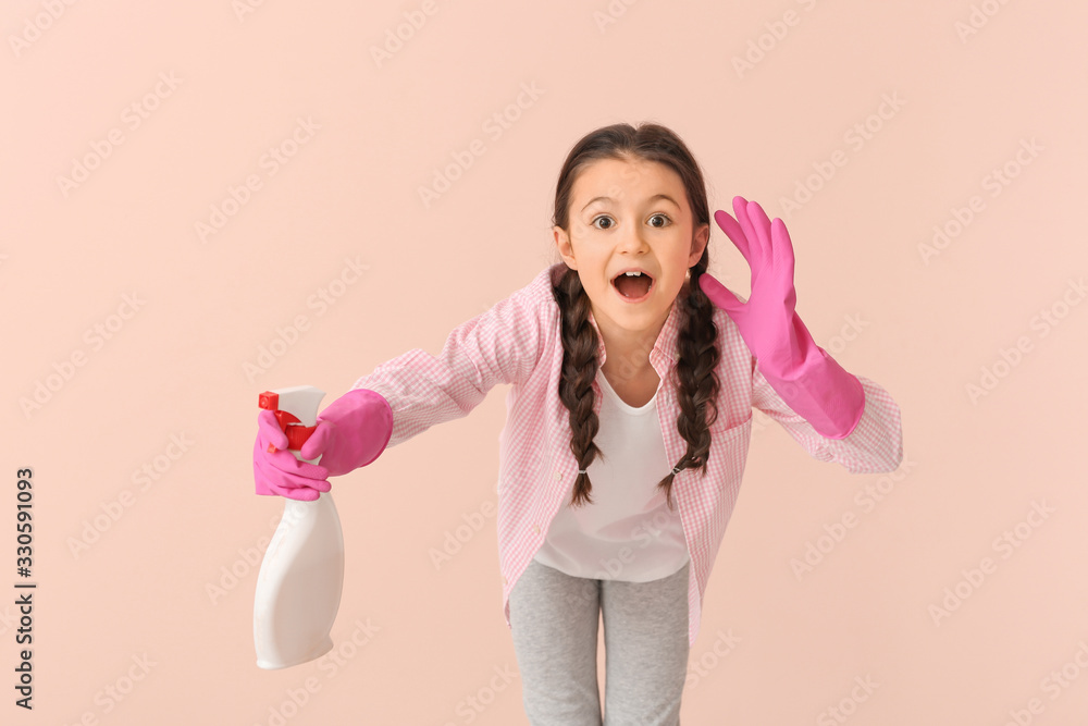 Surprised little housewife with bottle of detergent on color background