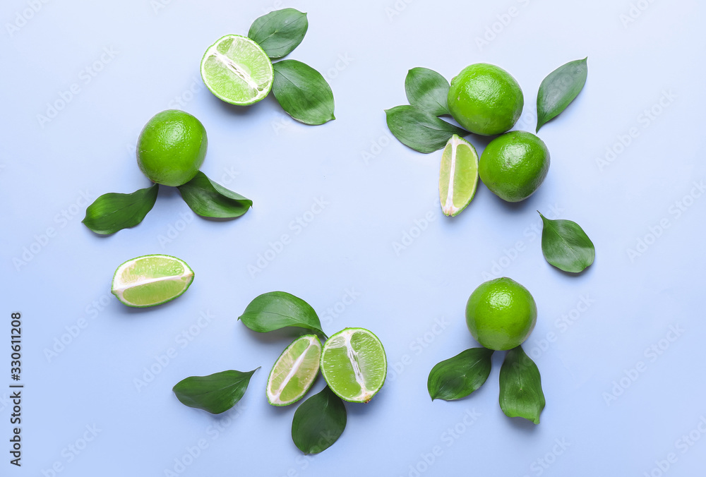 Fresh limes on color background