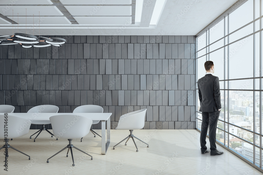 Businessman standing in conference office room