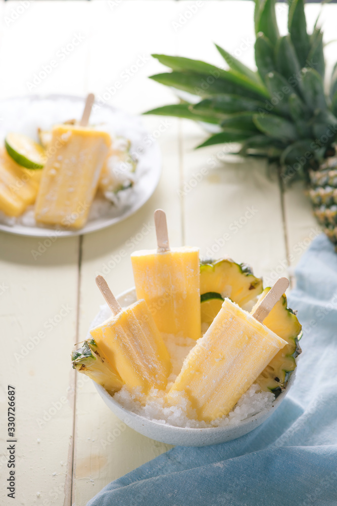 Homemade ice cream or popsicles from pineapple decorated. Top view. Frozen fruit pulp. Summer sweets