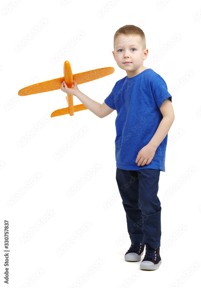 Little boy playing with a toy airplane.