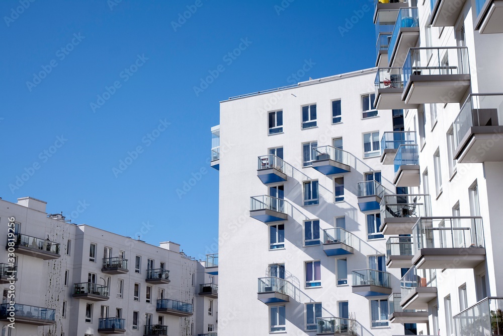 Modern and new apartment building. Multistoried modern, new and stylish living block of flats.