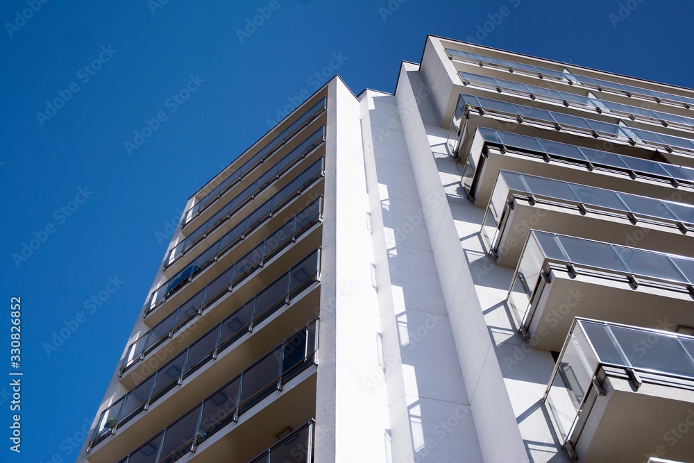 Modern and new apartment building. Multistoried modern, new and stylish living block of flats.