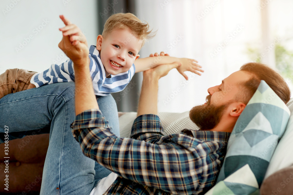 happy family  father and son at home.