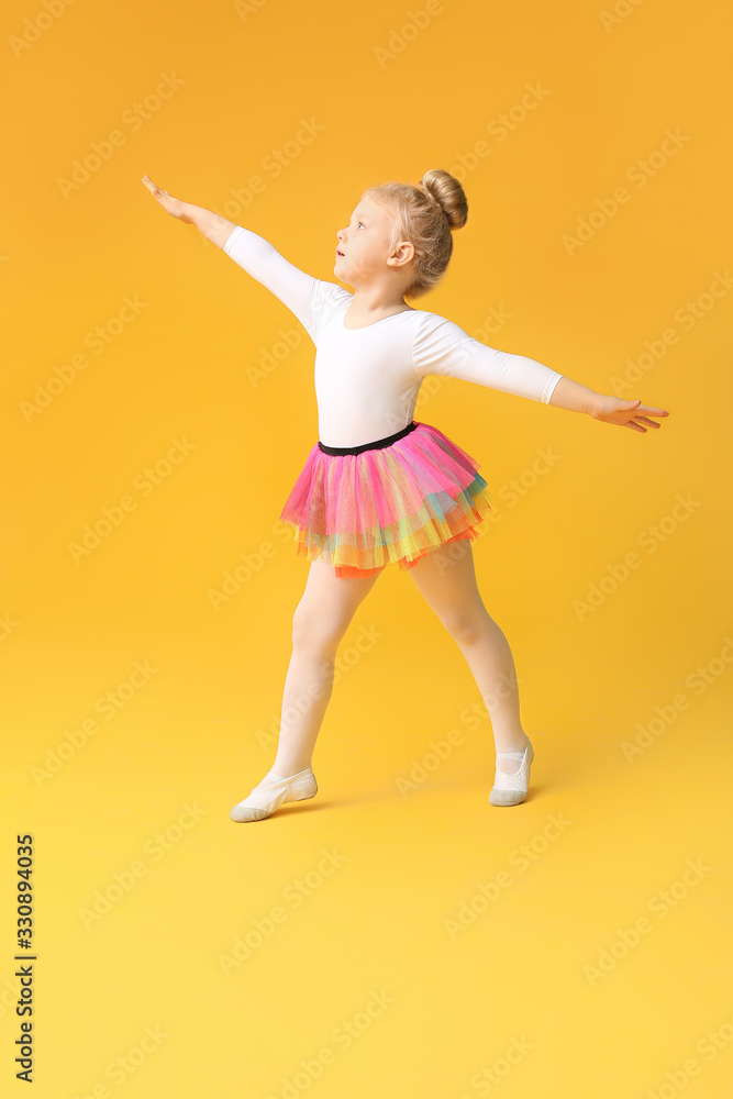 Cute little ballerina on color background