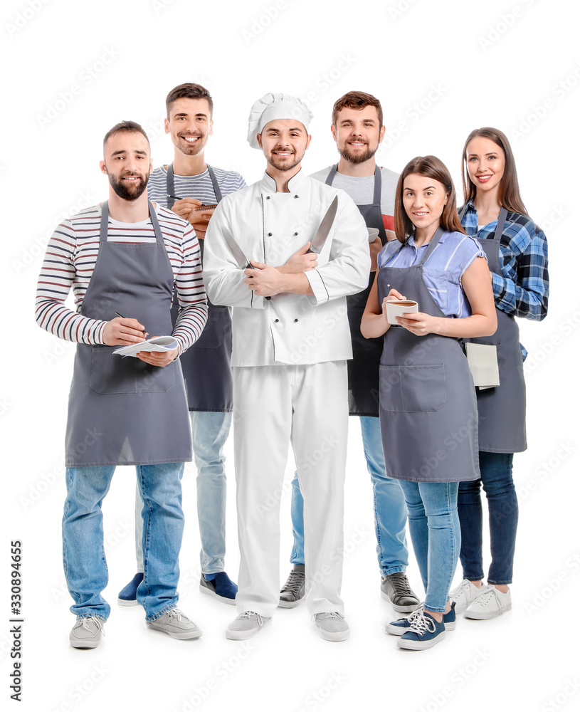 Male chef with participants of cooking classes on white background