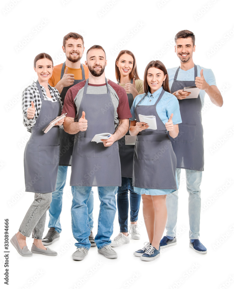 Participants of cooking classes showing thumb-up gesture on white background