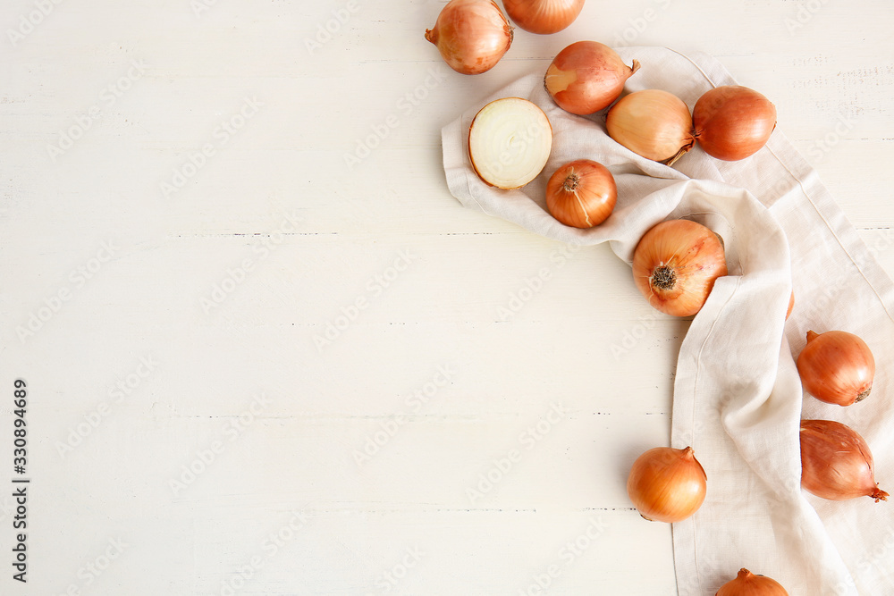 Fresh raw onion on white table