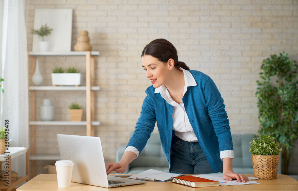 woman working on a laptop at home.