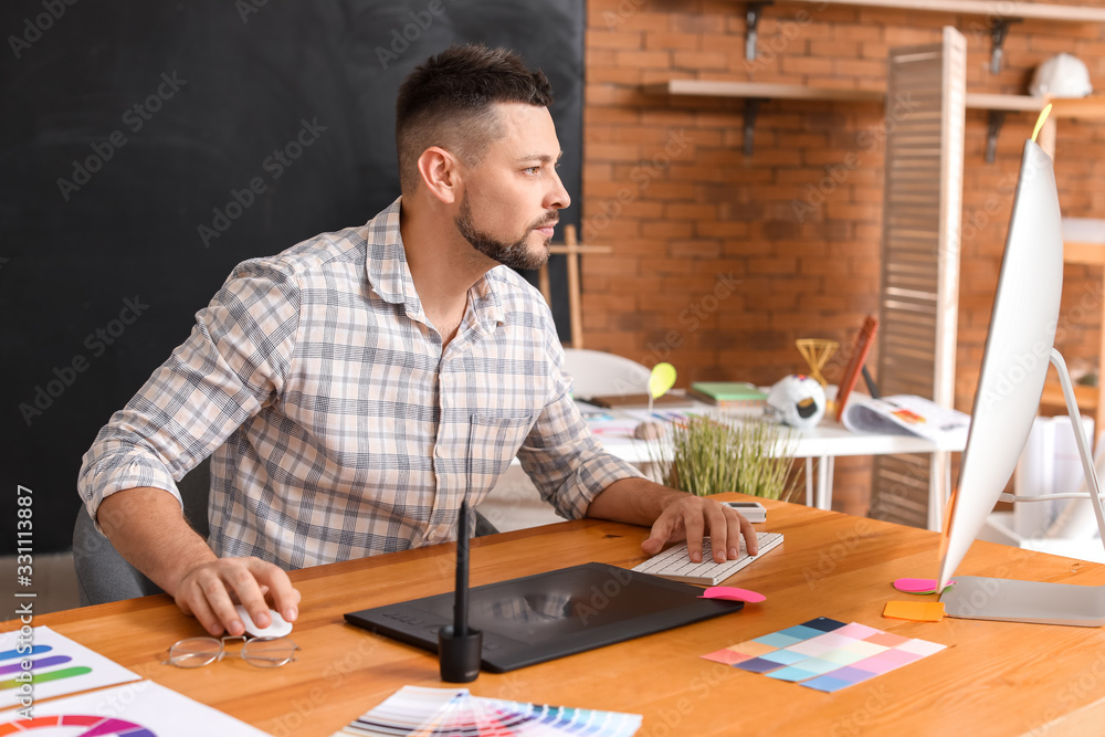 Male designer working in office