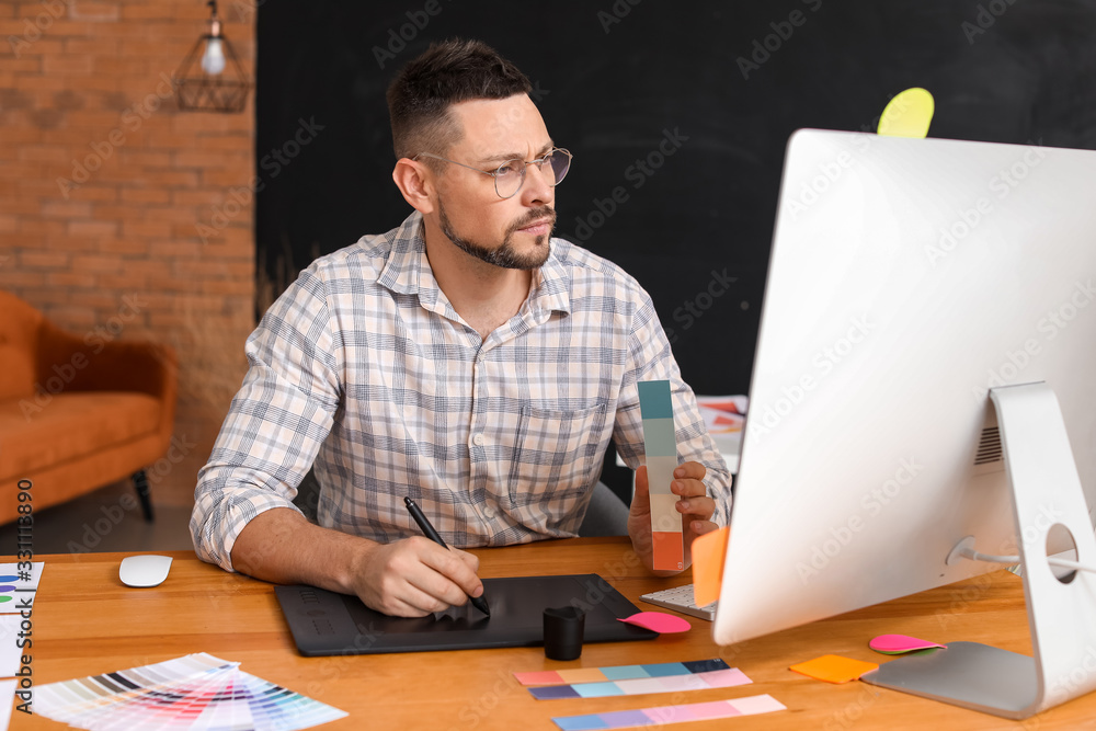 Male designer working in office