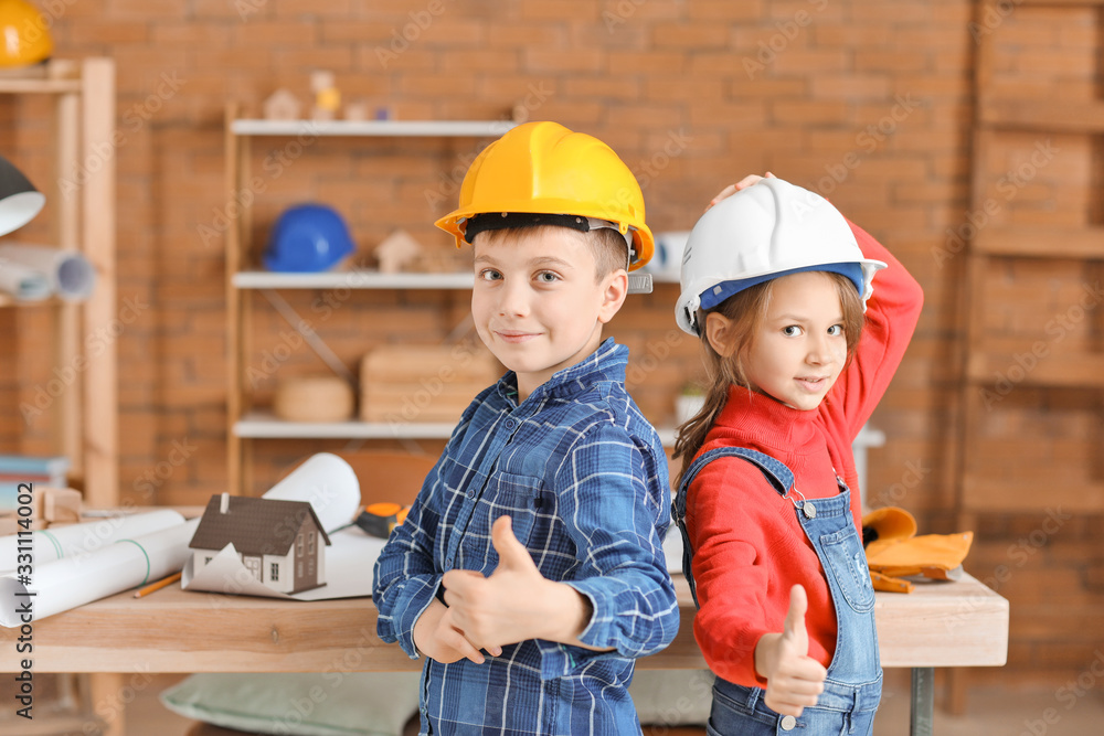 Cute little architects in office