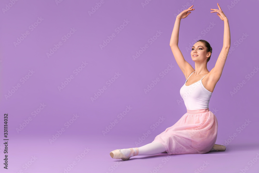 Beautiful young ballerina on color background