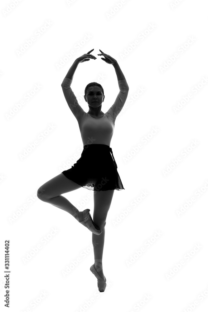 Silhouette of beautiful young ballerina on white background