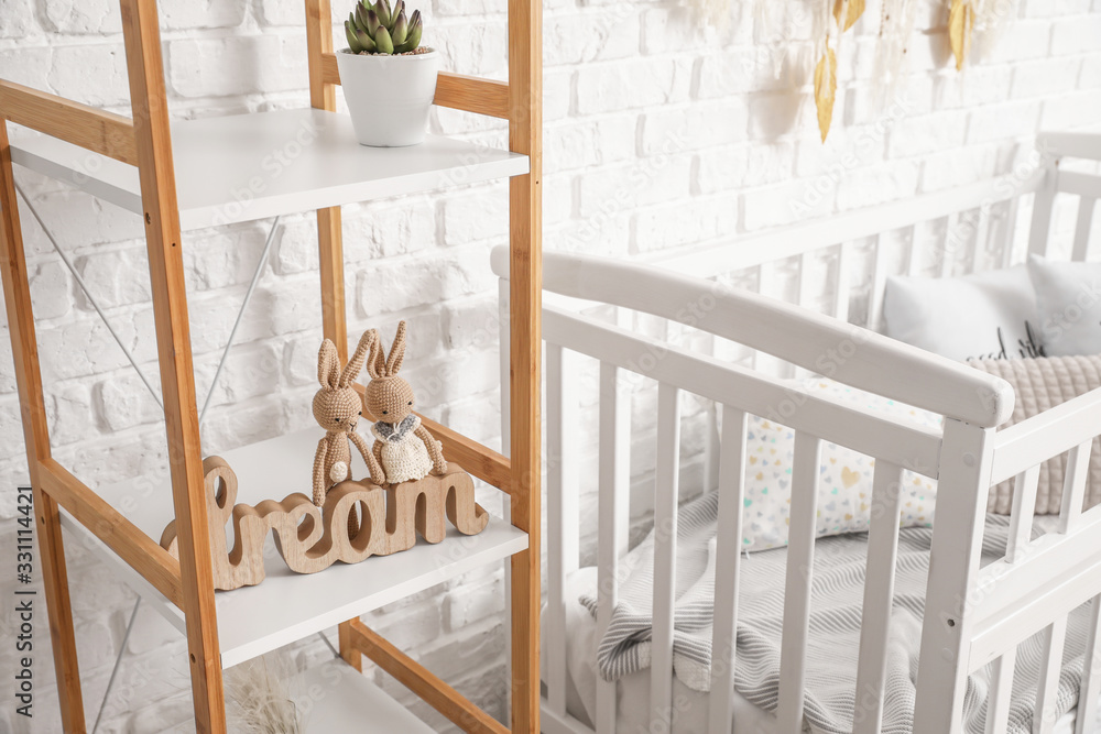 Shelving unit with toys in interior of childrens room