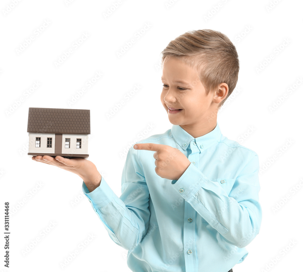 Portrait of little real estate agent with model of house on white background