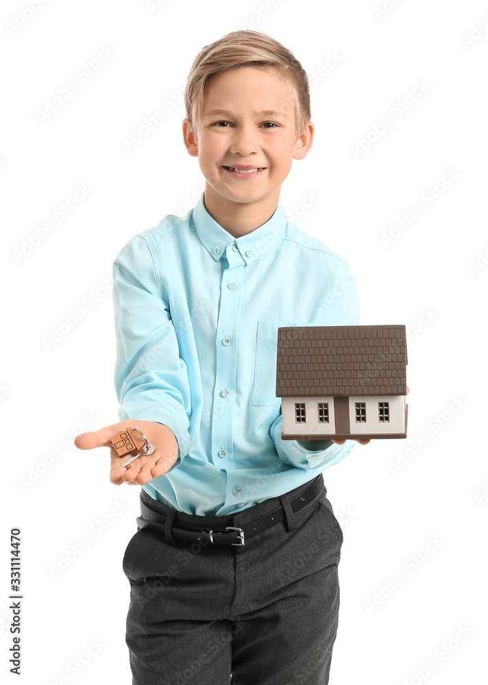 Portrait of little real estate agent with model of house and key on white background