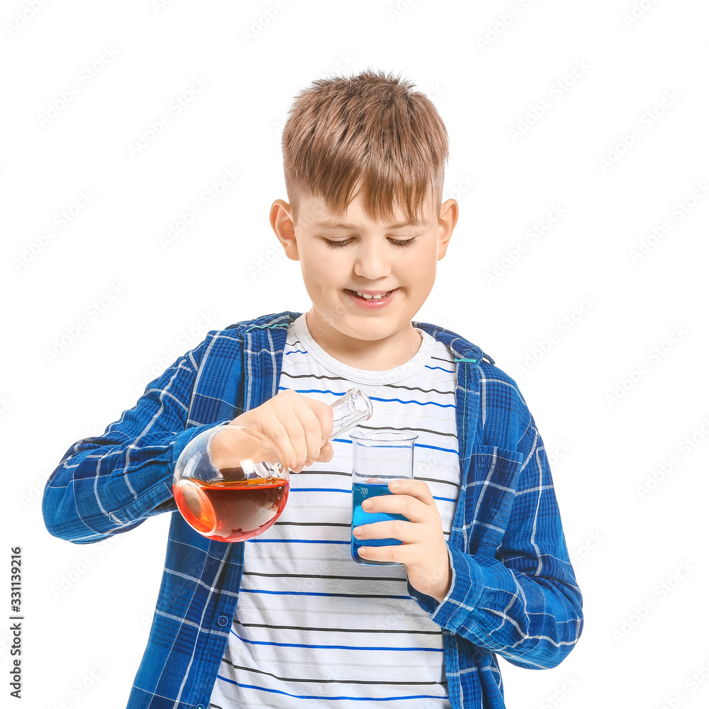 Cute little boy with laboratory glassware on white background