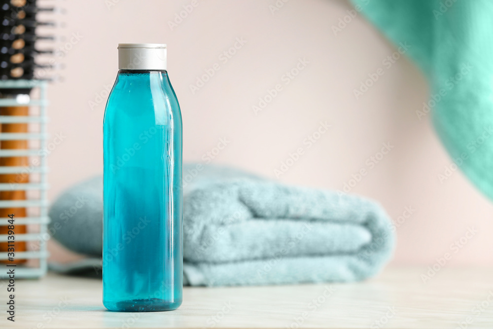 Bottle of shampoo on table