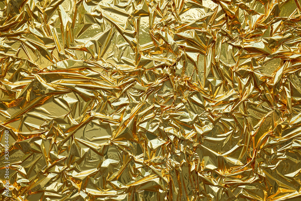 Golden metallic foil texture background