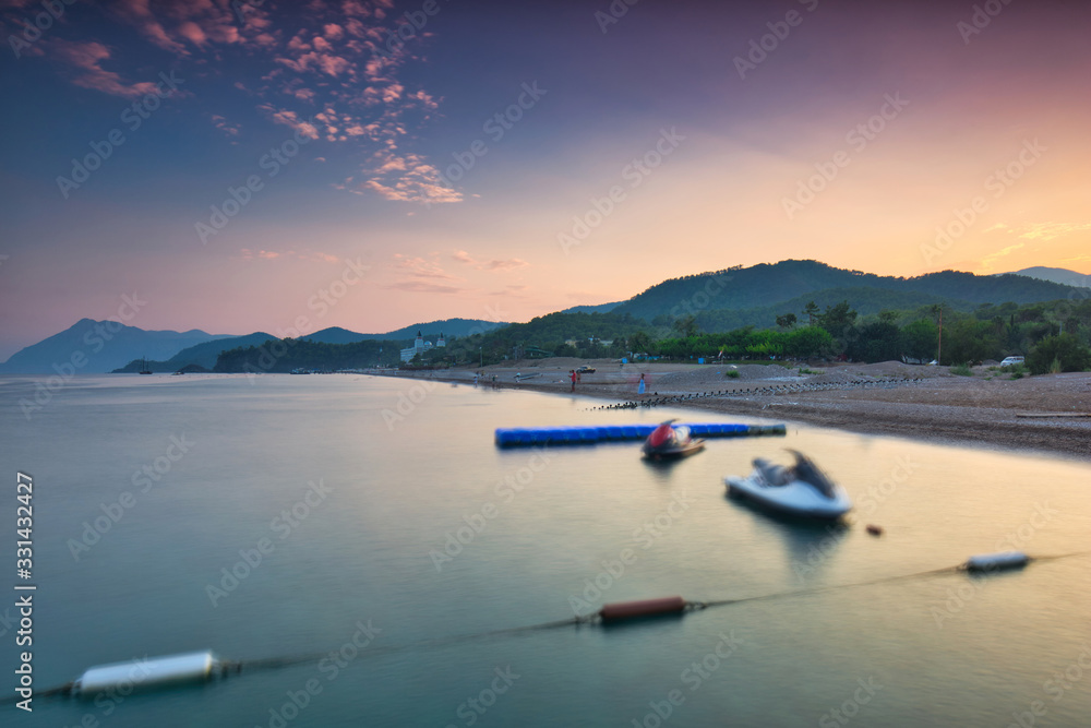 Amazing sunset on the coast of Turkish Riviera with Mount Tahtali in background, Tekirova