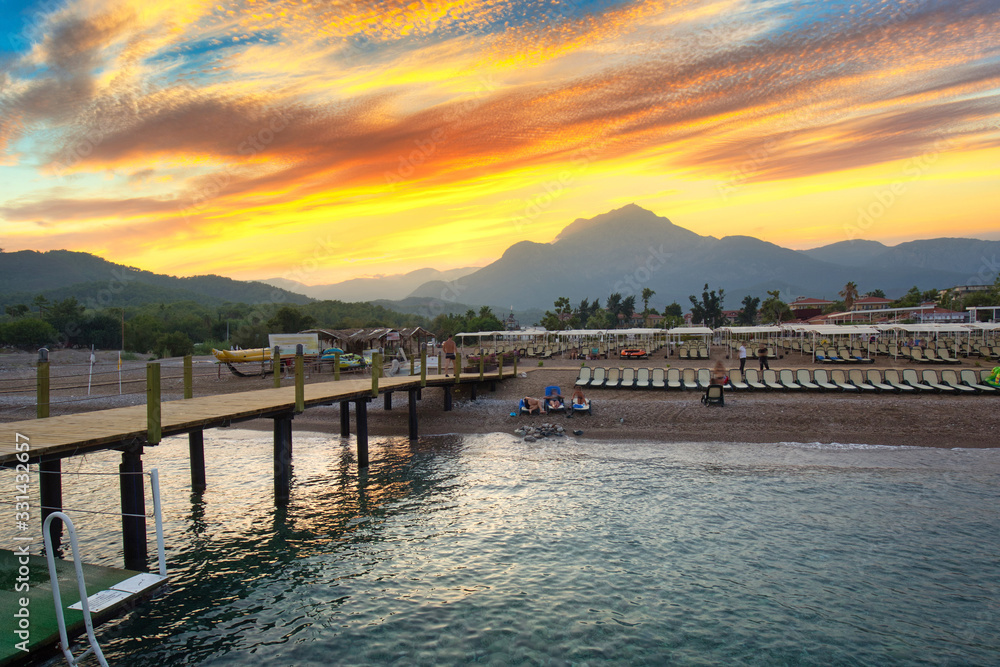 Amazing sunset on the coast of Turkish Riviera with Mount Tahtali in background, Tekirova