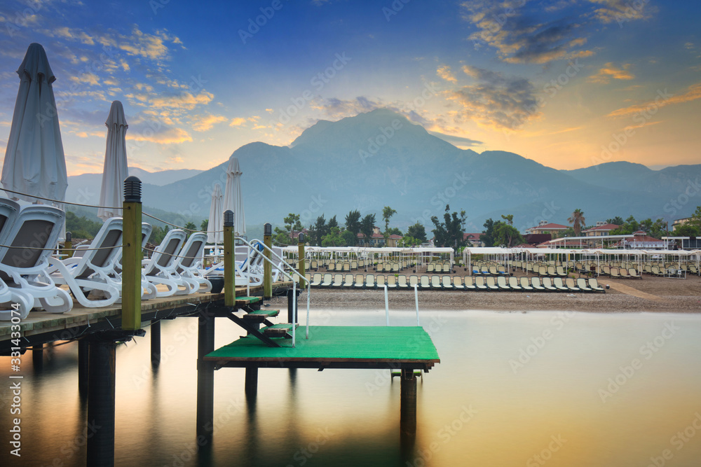 Amazing sunset on the coast of Turkish Riviera with Mount Tahtali in background, Tekirova