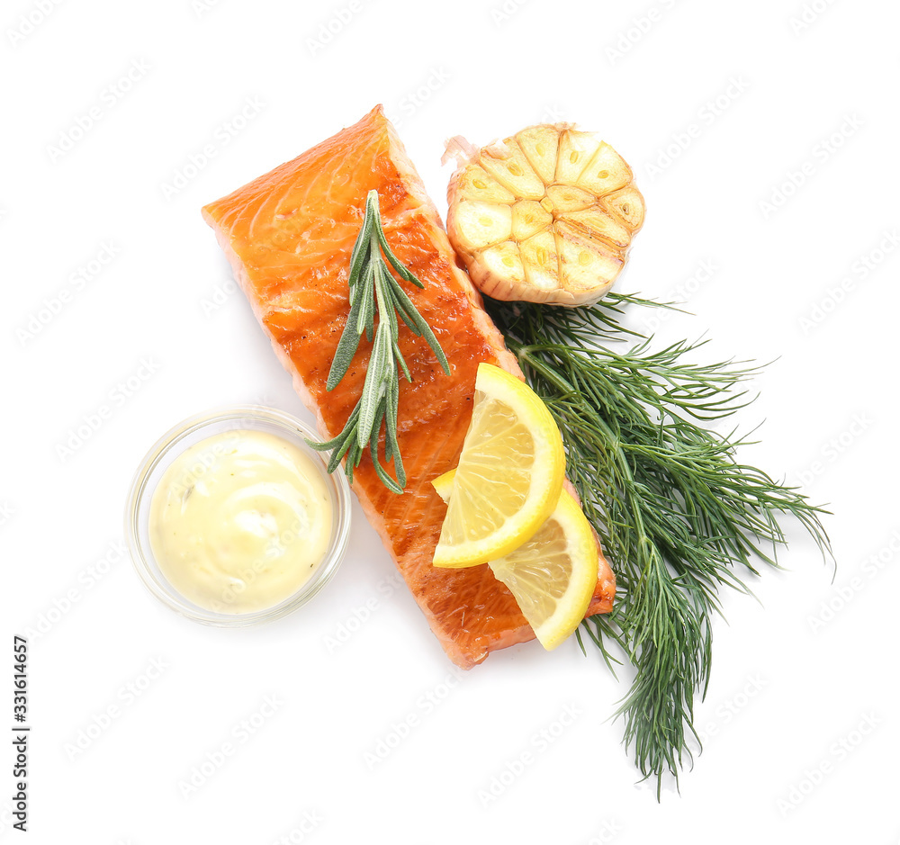 Cooked salmon fillet with sauce on white background