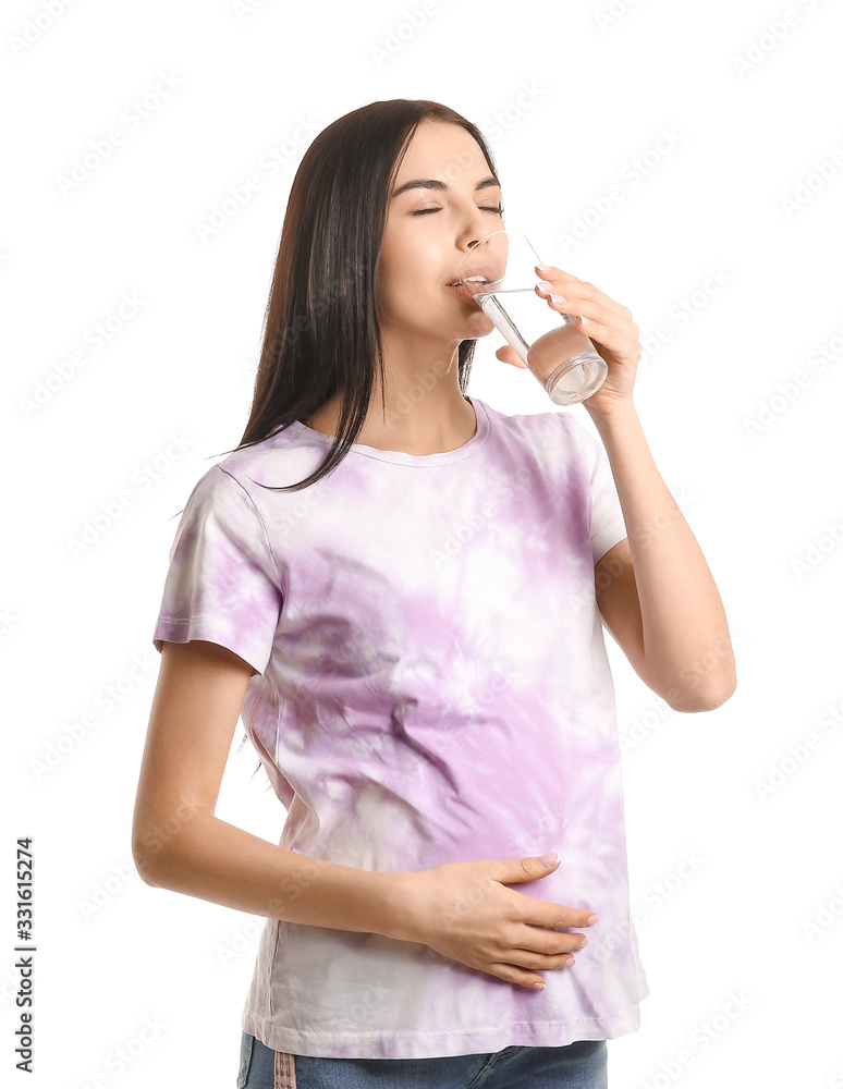 Beautiful pregnant woman with glass of water on white background