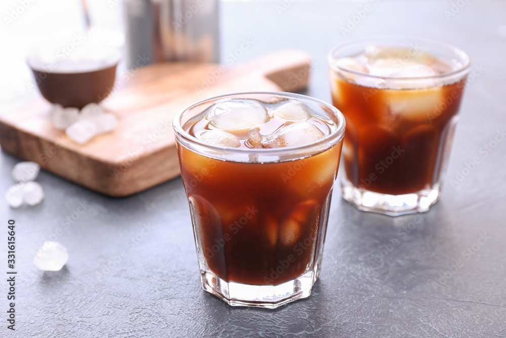 Glasses of tasty cold coffee on table