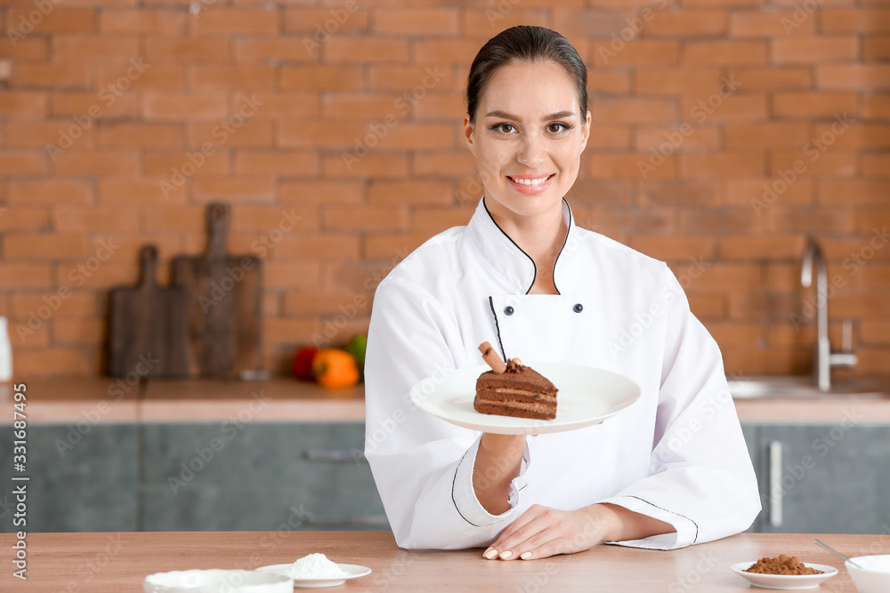 Female chef with tasty dessert in kitchen