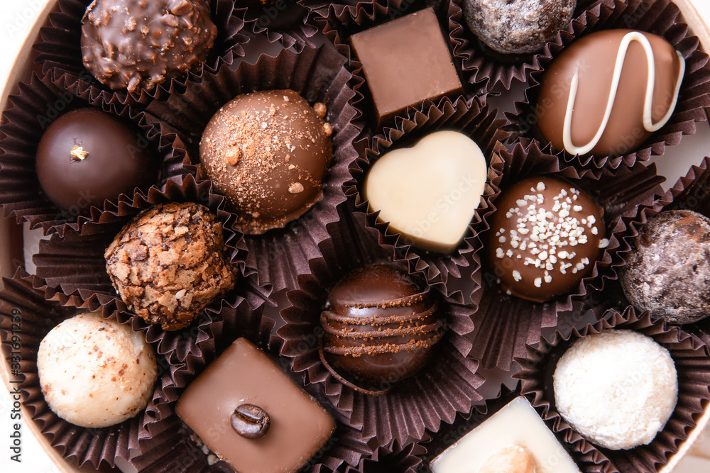 Box with delicious candies, closeup