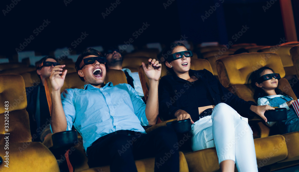 Group of people watch 3d movie in cinema theater