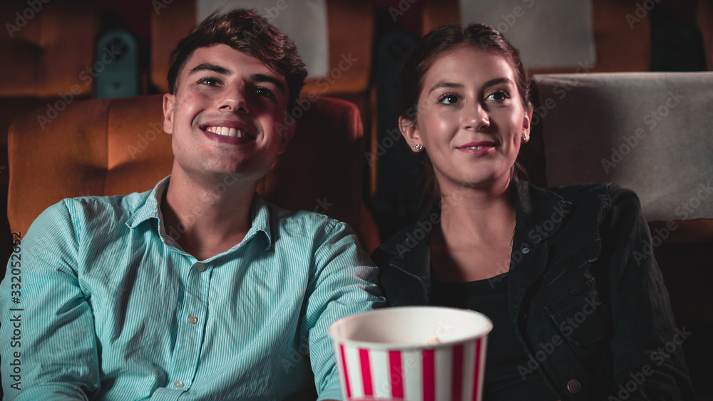 People audience watching movie in cinema theater.