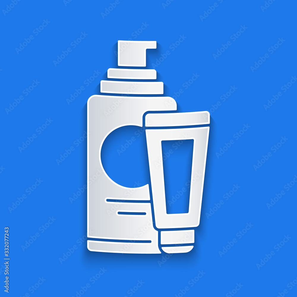 Paper cut Cream or lotion cosmetic tube icon isolated on blue background. Body care products for men