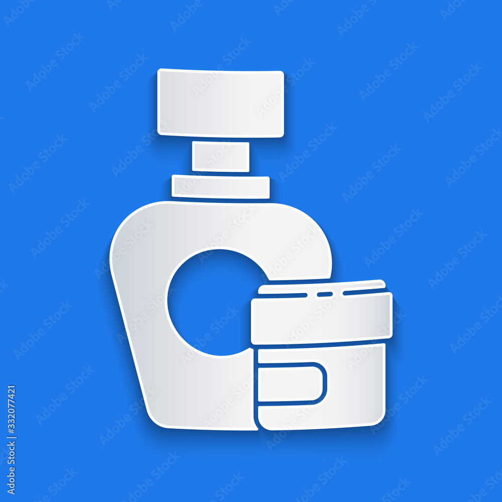 Paper cut Cream or lotion cosmetic tube icon isolated on blue background. Body care products for men