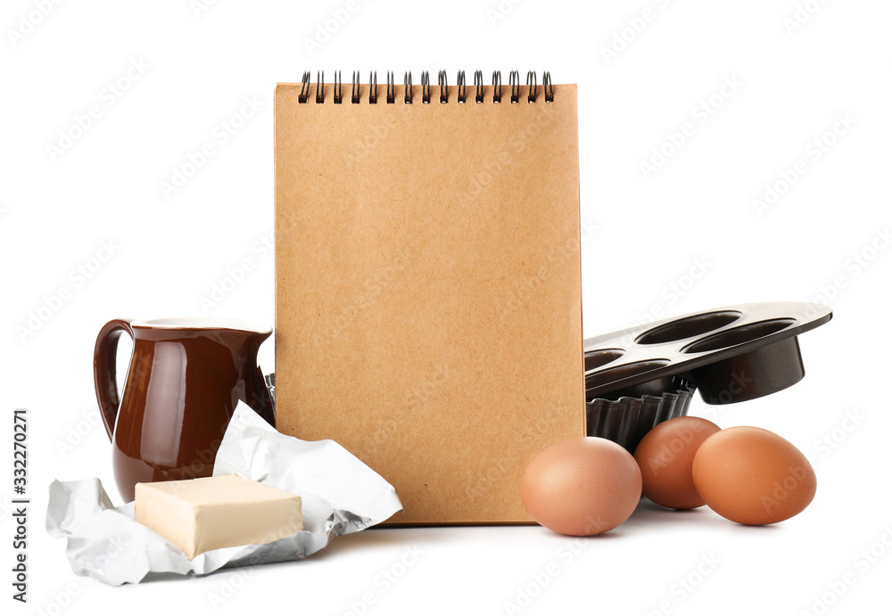 Cook book with products on white background