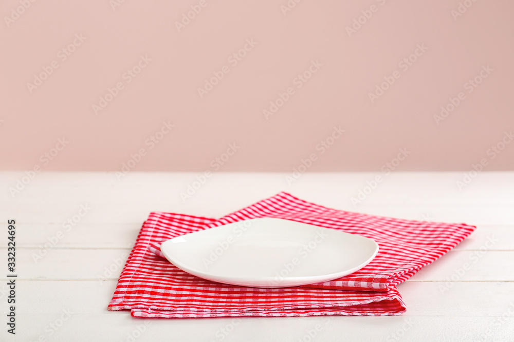 Plate and napkin on table