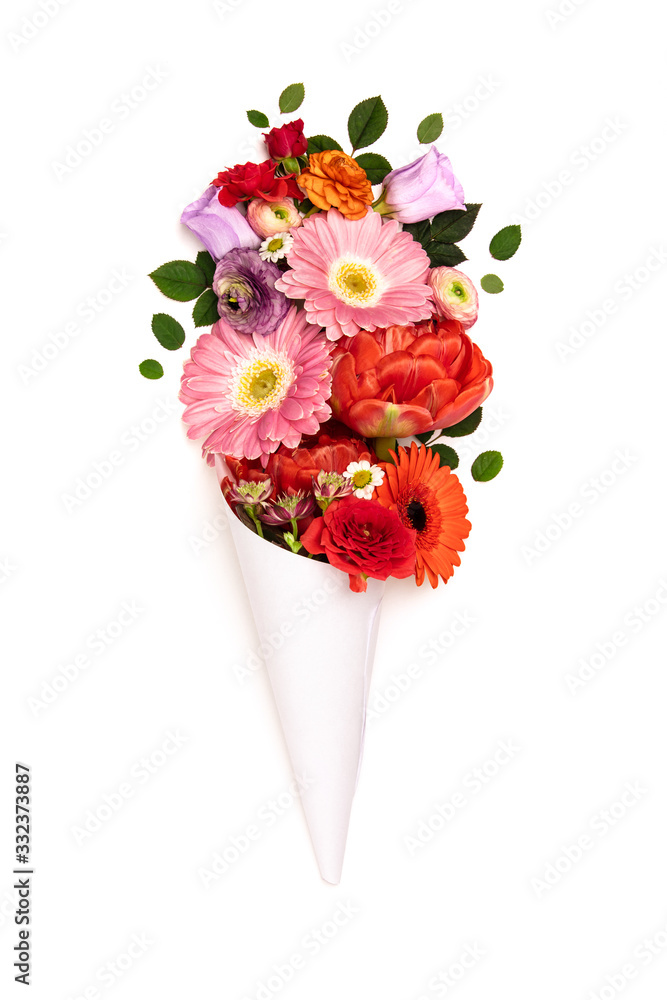 Bouquet of flowers in paper cone on a white background