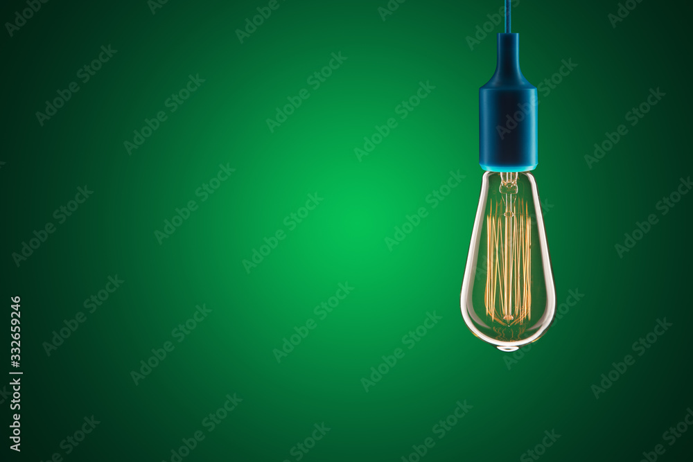 Idea and leadership concept - bulbs on the green background