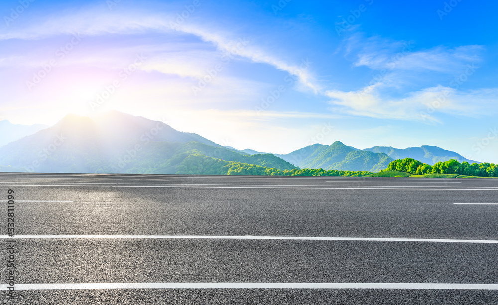 Asphalt road and green tea mountain nature landscape on sunny day,panoramic view.