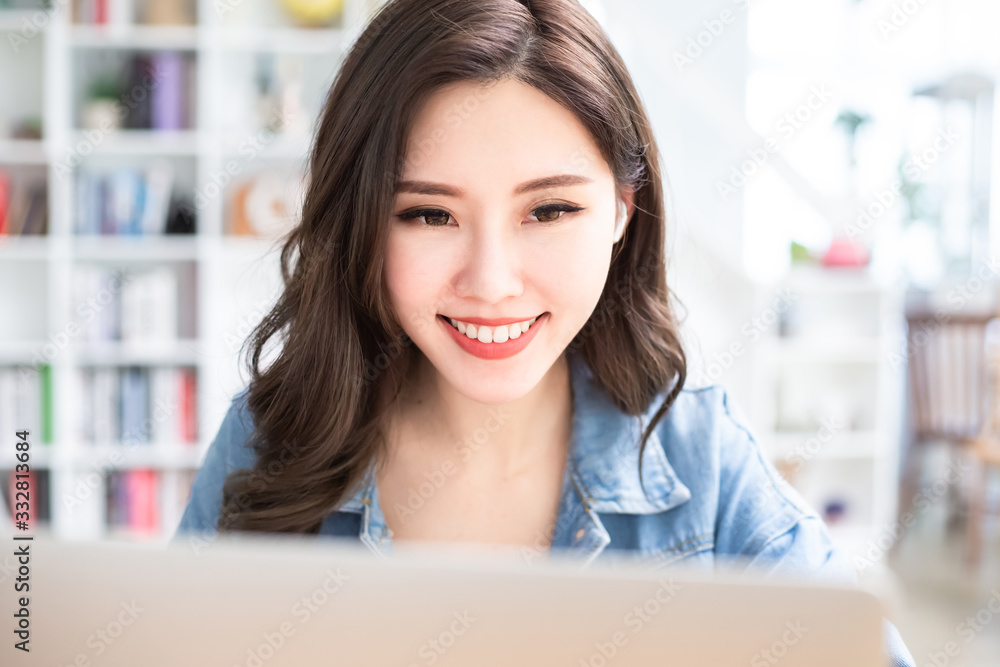 student using laptop at home