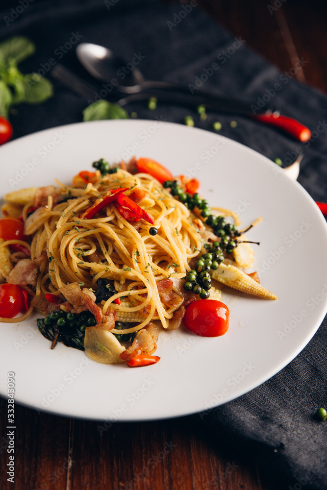 Spicy Drunken Spaghetti. Add ham, garlic, pepper, fresh chilies, baby corn on a white plate. Look fr