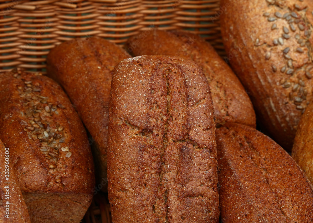 Assorted fresh bread loaves on retail display