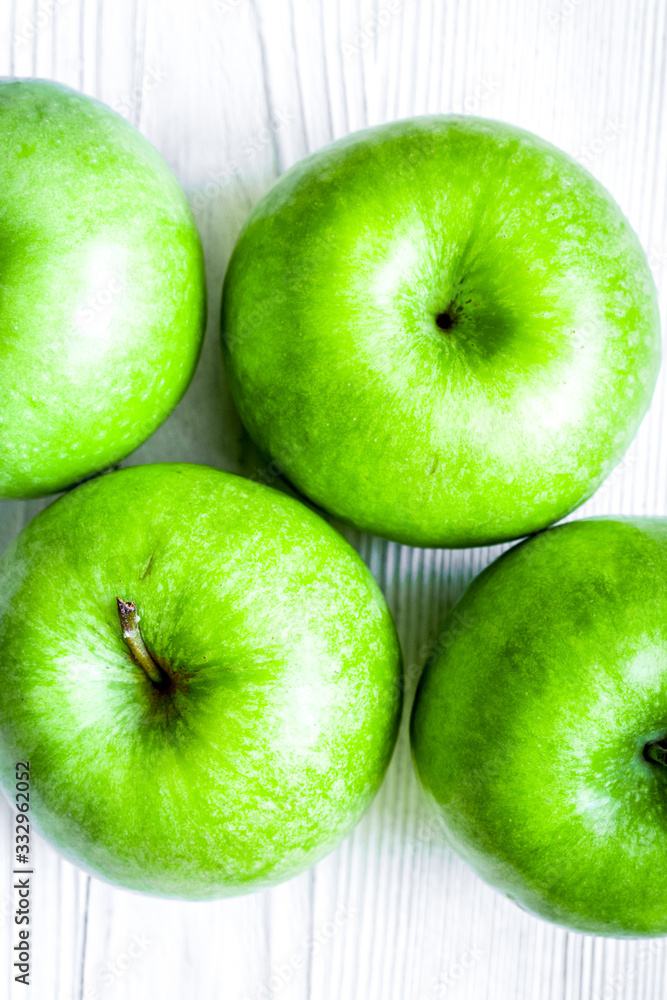 ripe green apples white table background