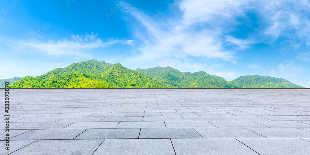 Empty square floor and green mountain nature landscape on sunny day,panoramic view.