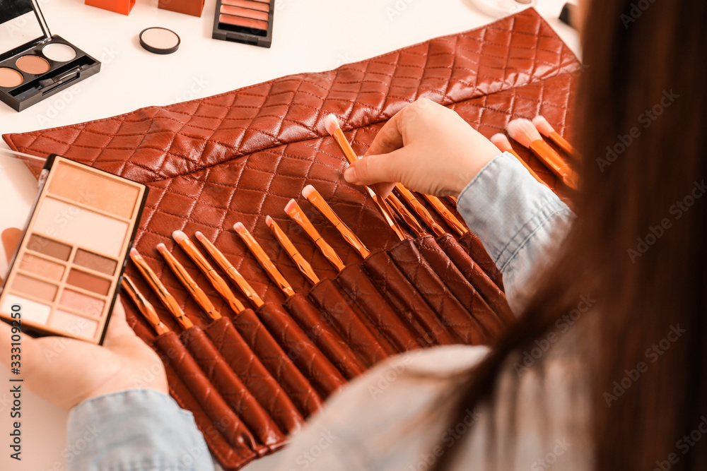 Makeup artist at workplace in beauty salon